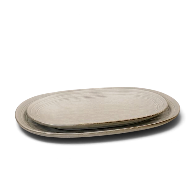 Maison Oie Satchville stoneware large oval serving plate with a rustic grey glazed finish on a white wooden surface.