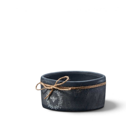 Black ceramic decorative bee bowl with textured finish, white bee motif and natural jute twine bow, perfect for rustic farmhouse and country cottage home décor.