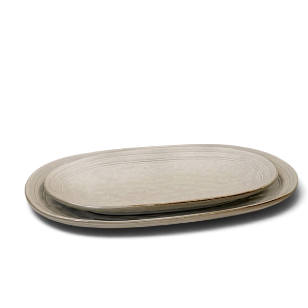 Maison Oie Satchville stoneware medium oval plates in a rustic grey finish with subtle ribbed detailing.