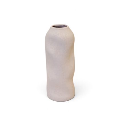 Maison Oie white tall sculptured vase with a unique textured organic shape on a wooden surface.