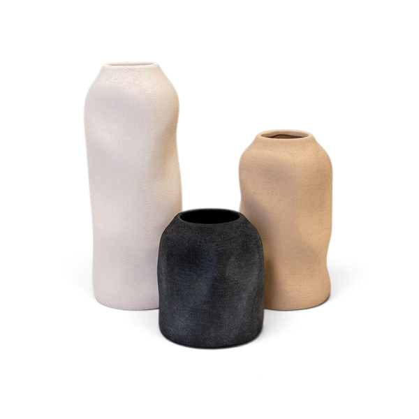 Maison Oie set of three tall sculptured textured vases in white, beige, and black with organic shapes.