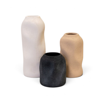 Maison Oie set of three tall sculptured textured vases in white, beige, and black with organic shapes.
