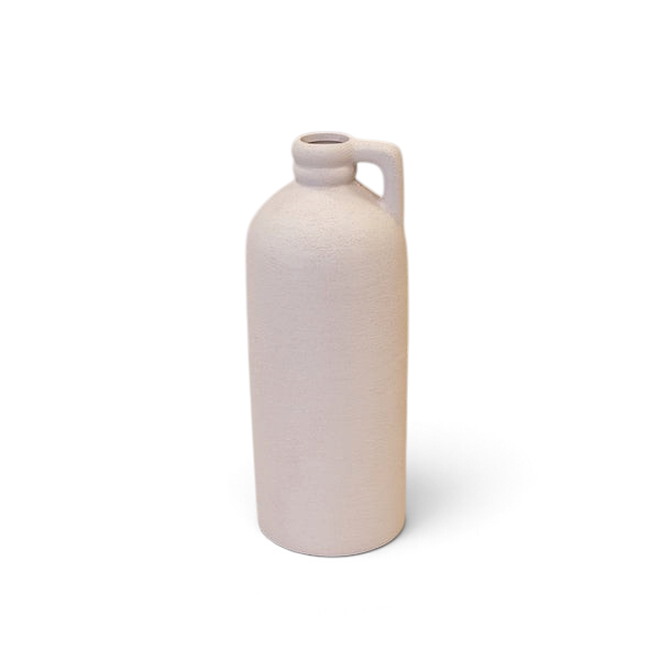 Maison Oie white tall textured ceramic jug with a minimalist handle design on a wooden surface.
