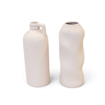 Maison Oie white tall textured jug and matching sculptural vase with a matte finish on a clean white background